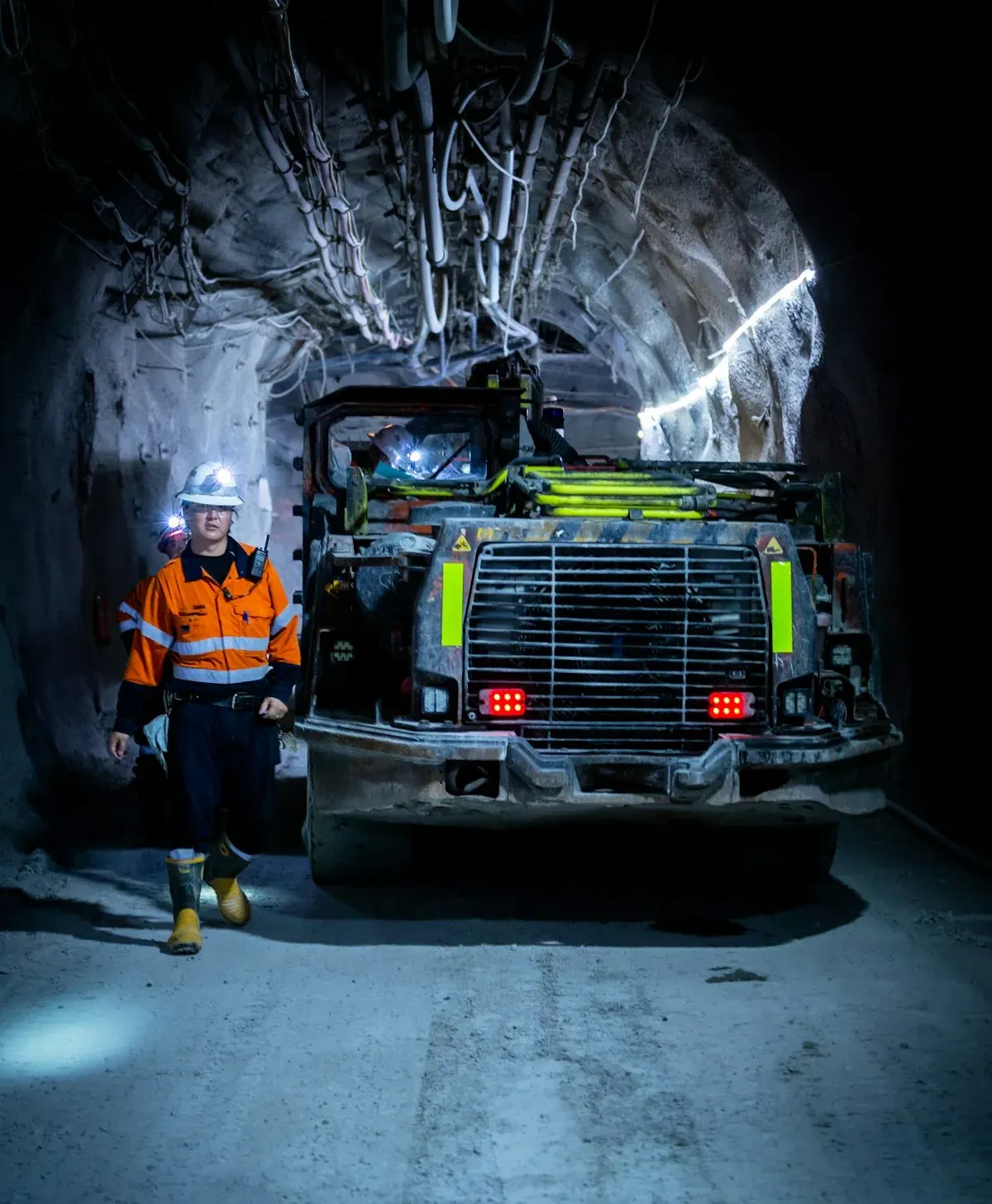 Mine worker in safety gear at a mining site