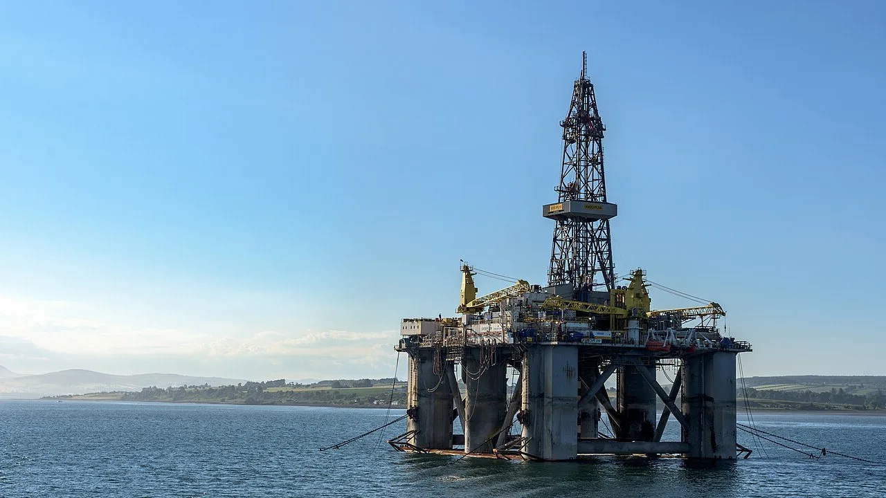 Offshore drilling rig under a clear blue sky